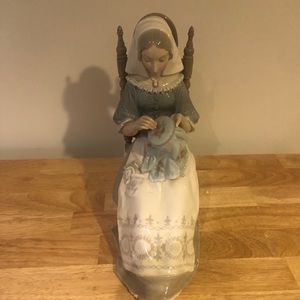 Woman sewing lladro